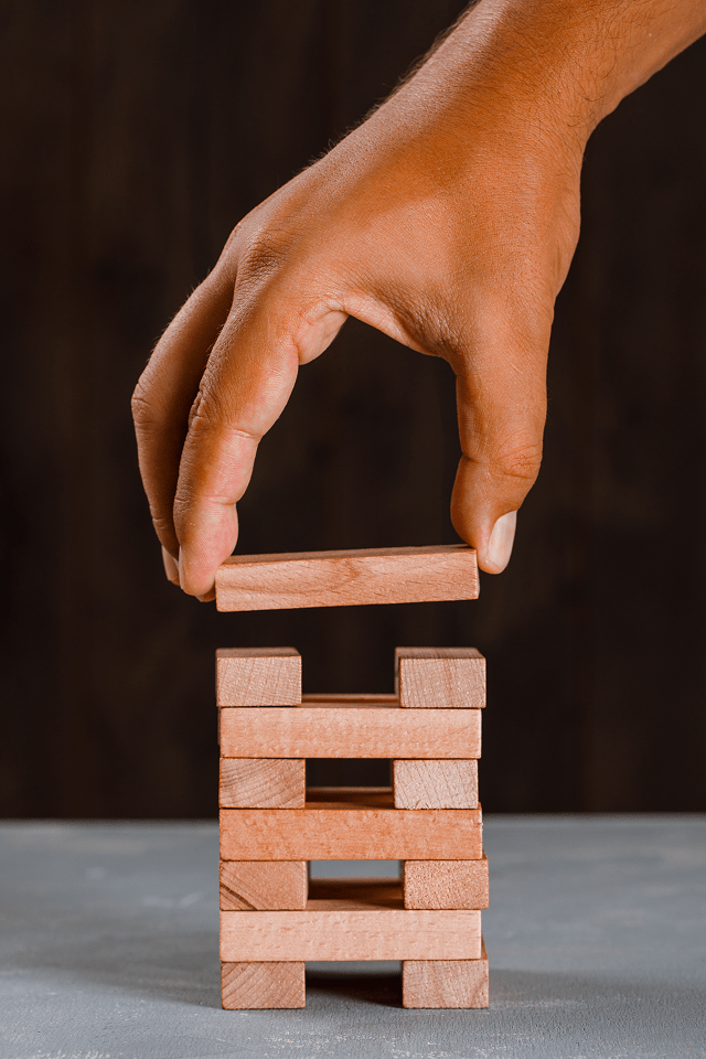 man building up tower 1