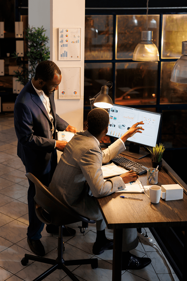 manager analyzing financial growth report with coworker 1